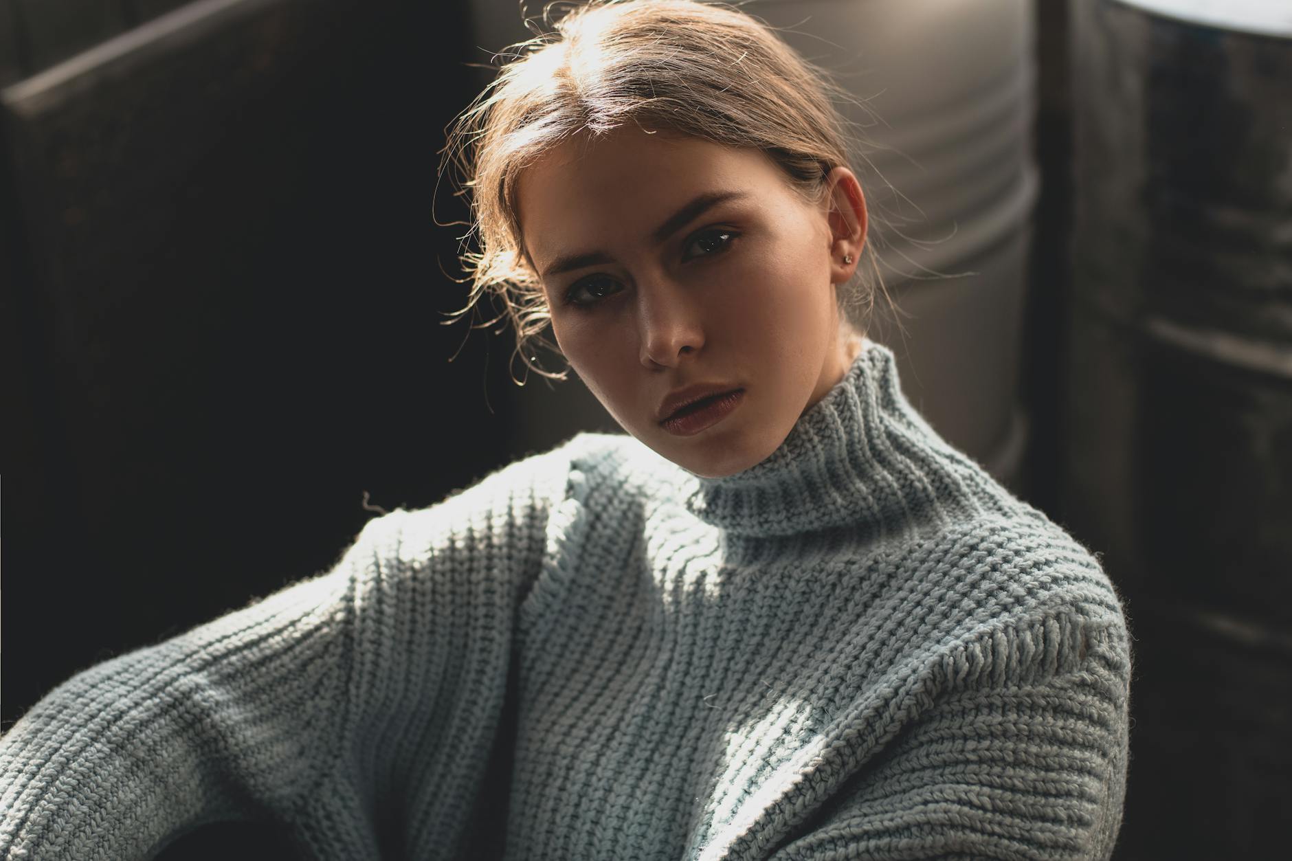 woman in gray turtleneck sweater